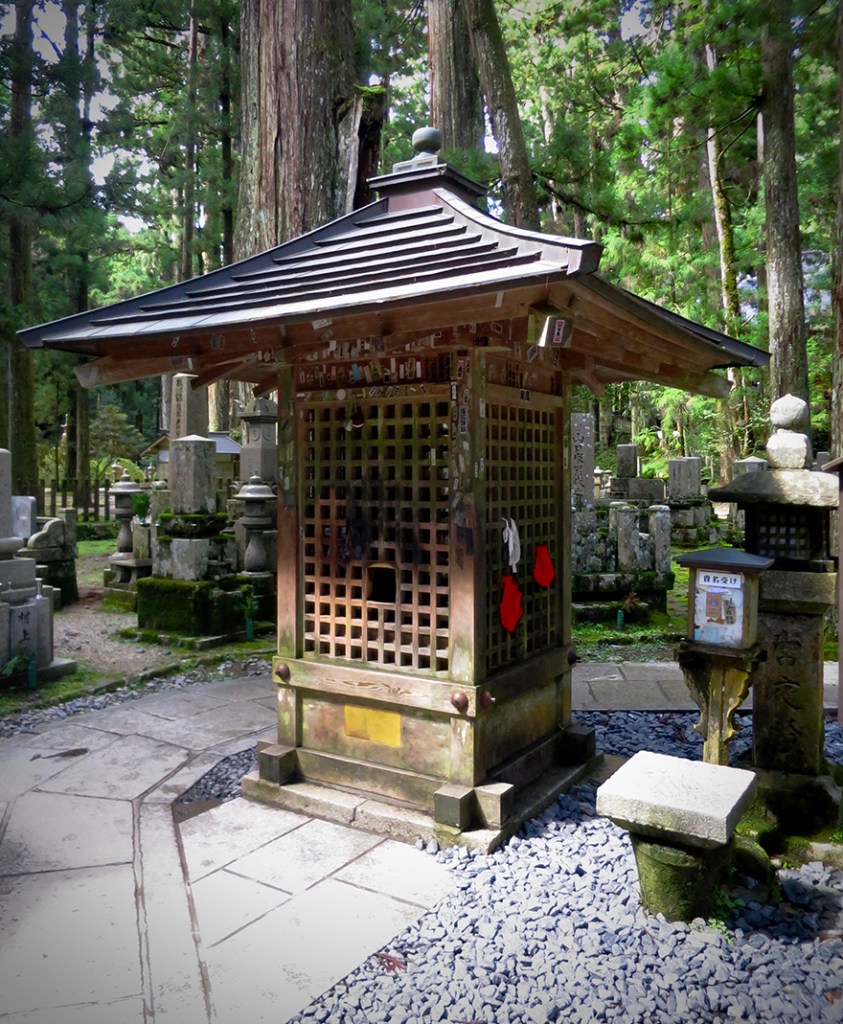 Wooden booth housing the test for pure heart stone in Koya-san graveyard