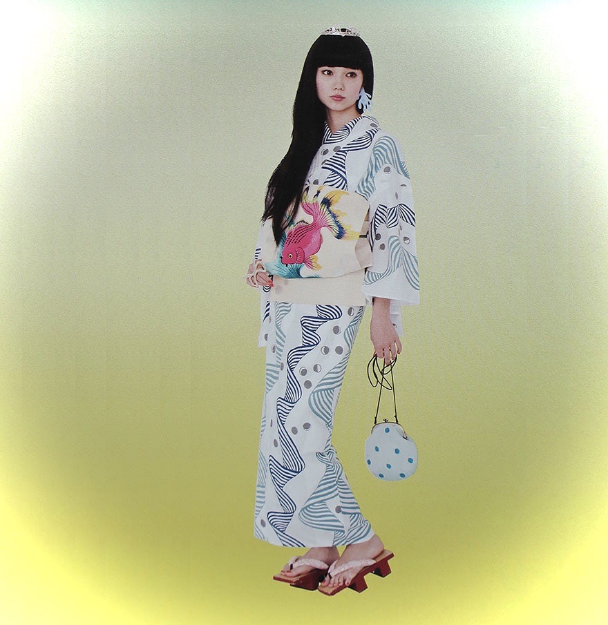 Young Japanese woman wearing summer yukata from Kimono Hime magazine