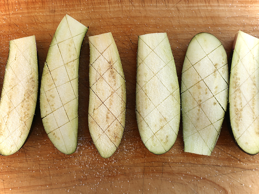 Salted Japanese eggplant on cutting board