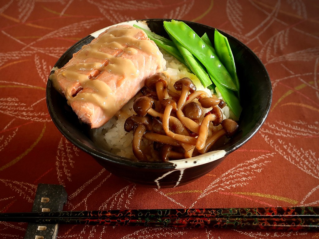 Japanese rice bowl with miso-sauced poached salmon, peppery marinated mushrooms and snow peas with soy-lemon dressing