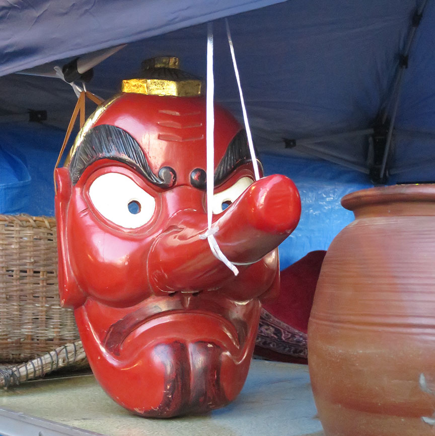 Carved wooden tengu mask being sold at the Setagaya Boroichi flea market in Tokyo
