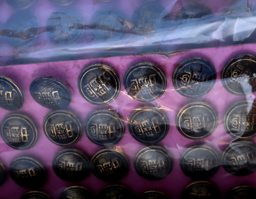 Japanese school uniform buttons being sold at the Setagaya Boroichi flea market in Tokyo