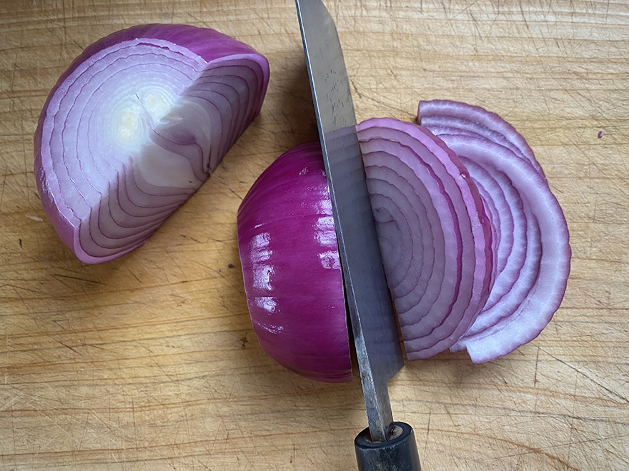 Cutting red onion for Pink Pickled Onions