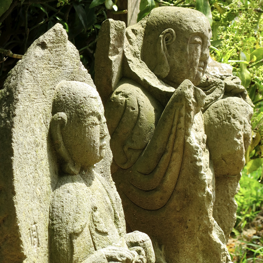 Stone Jizo figures at the Nihon Minka-en Japanese Folk House Garden