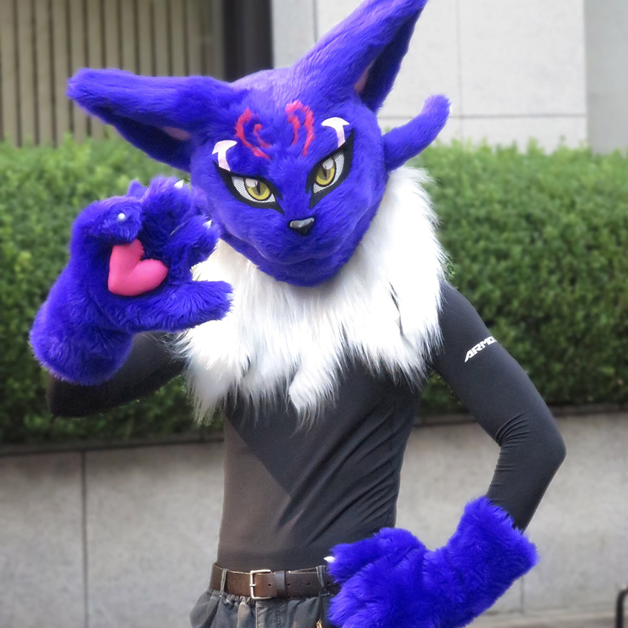 Someone dressed up as a purple anime cat in the Bakeneko Parade in Kagurazaka
