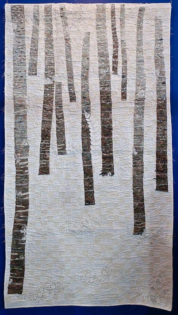 Quilt of tree trunks in winter