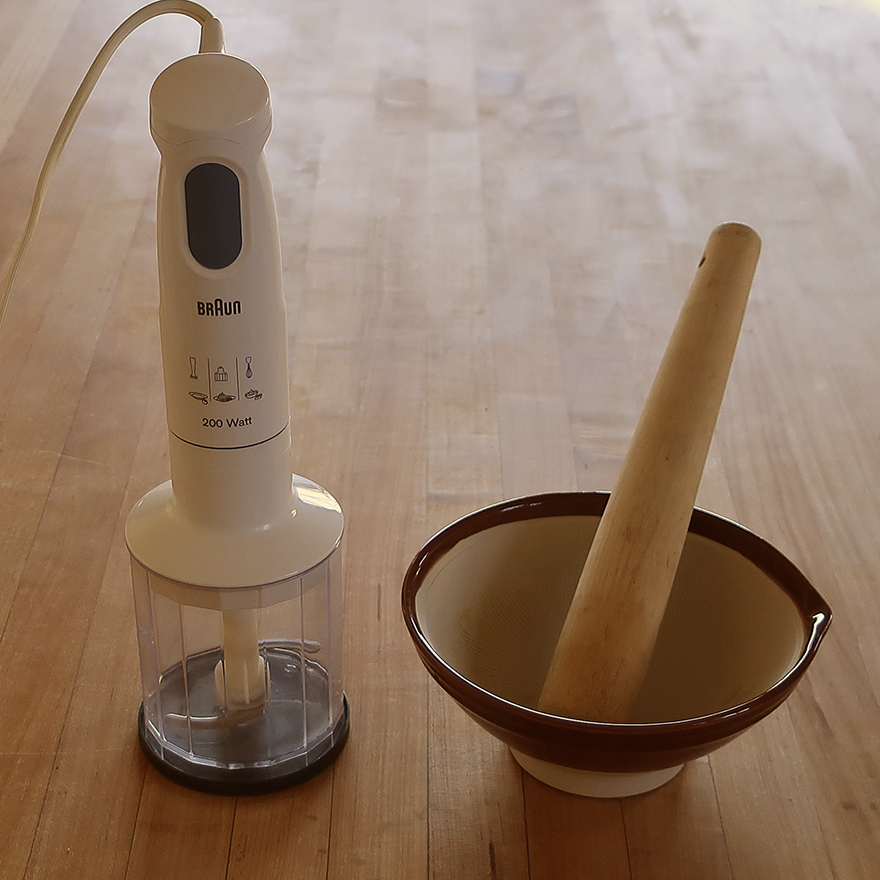Immersion blender and suribachi Japanese morter and pestle on wooden table