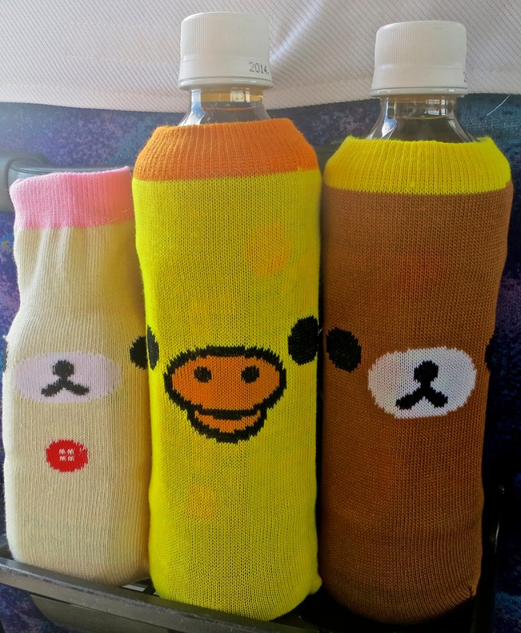 Bottles of water with cute sweater wraps