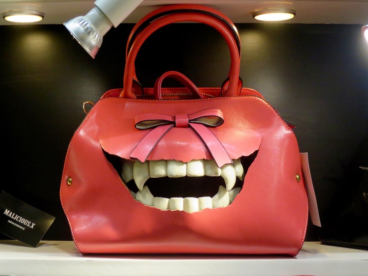 Red purse with grinning vampire teeth