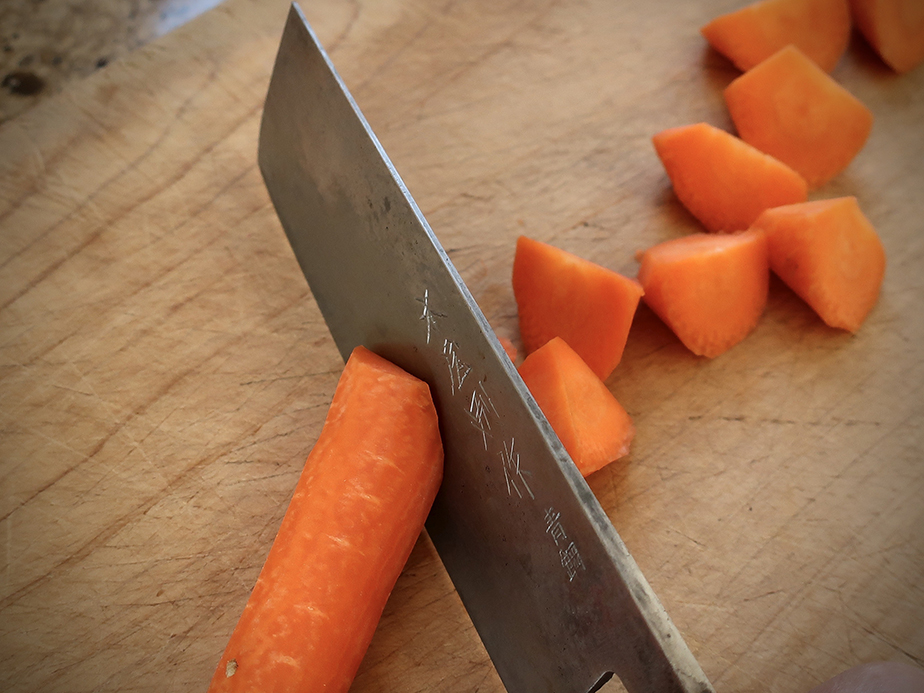 Knife cutting carrots
