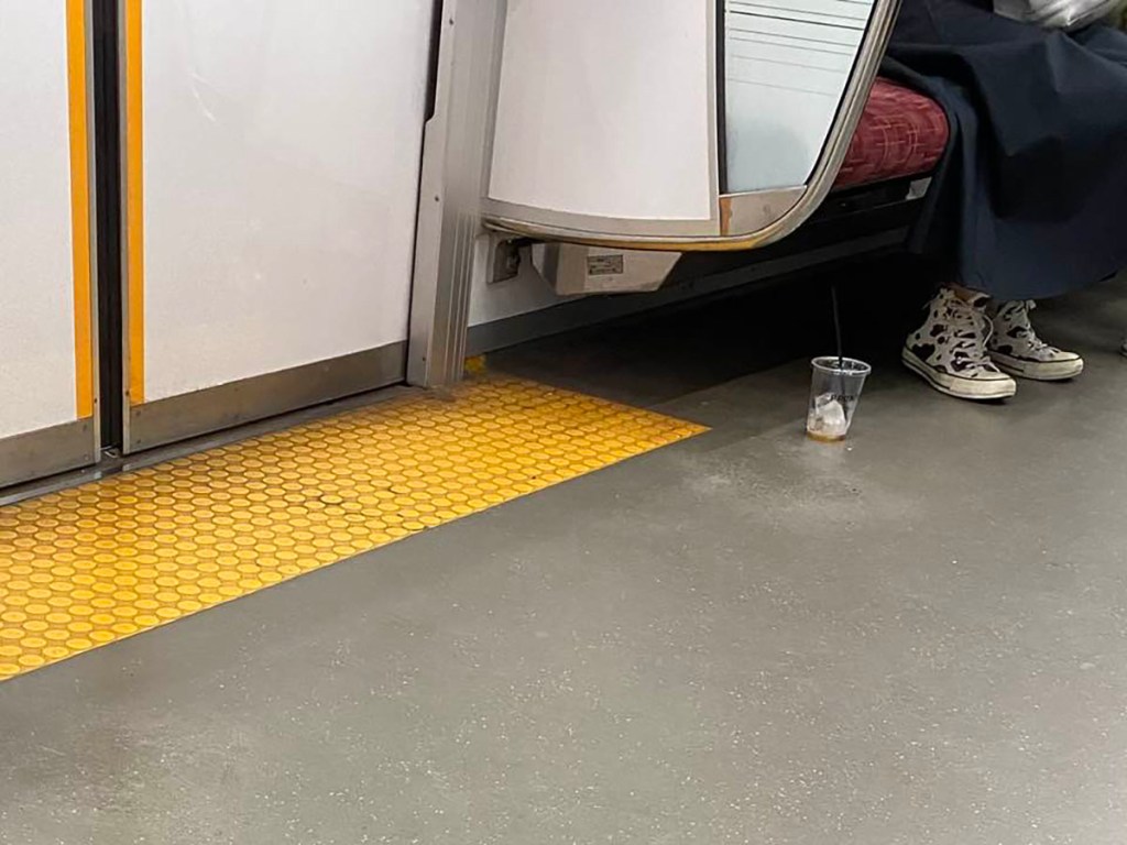 Abandoned coffee cup on subway