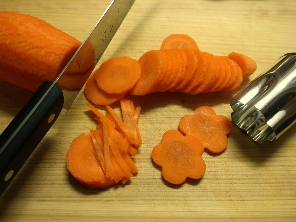 Cutting carrots for vegetable salad